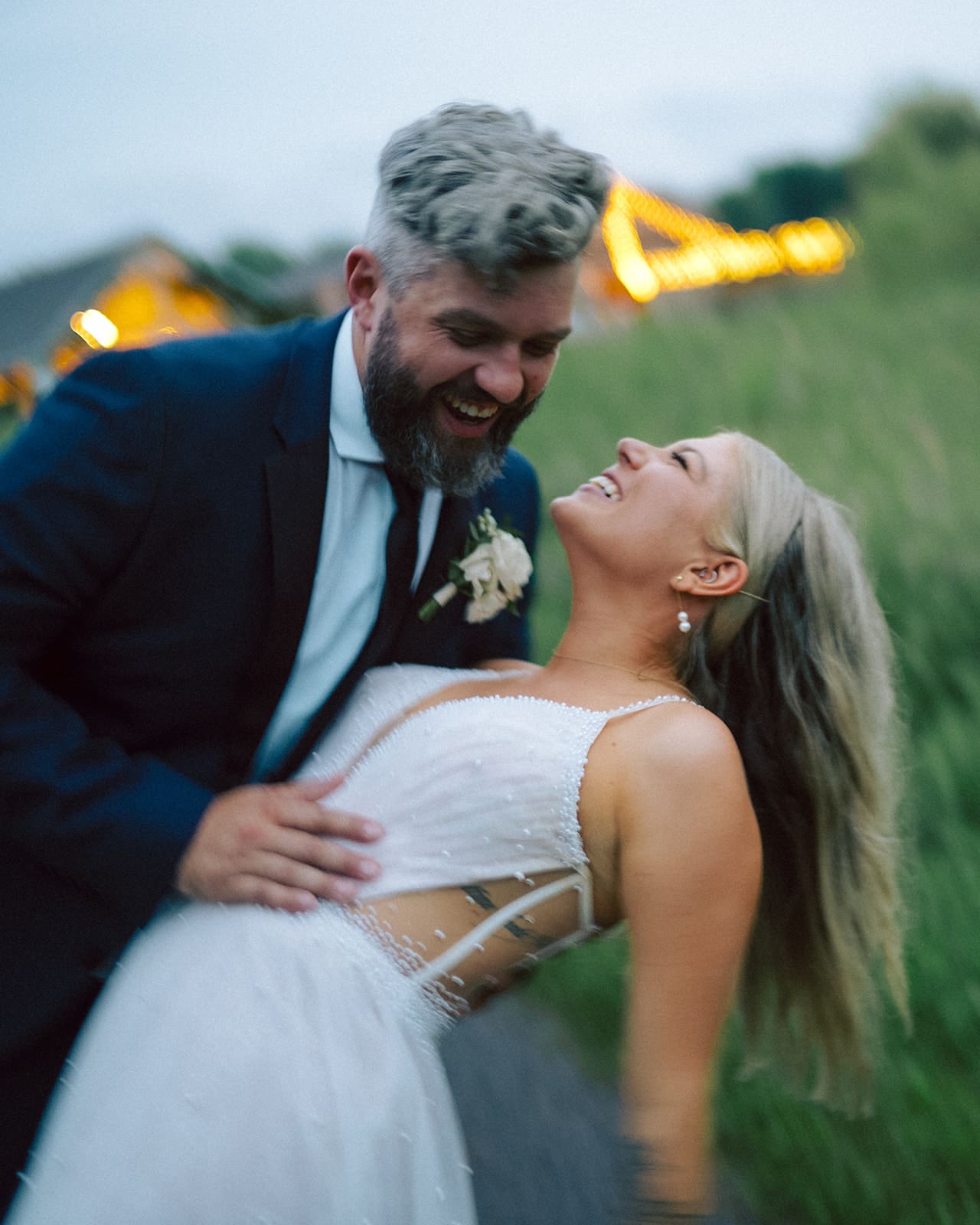 Groom dipping bride at outdoor 100 Acre Wood wedding in Prince Edward County.