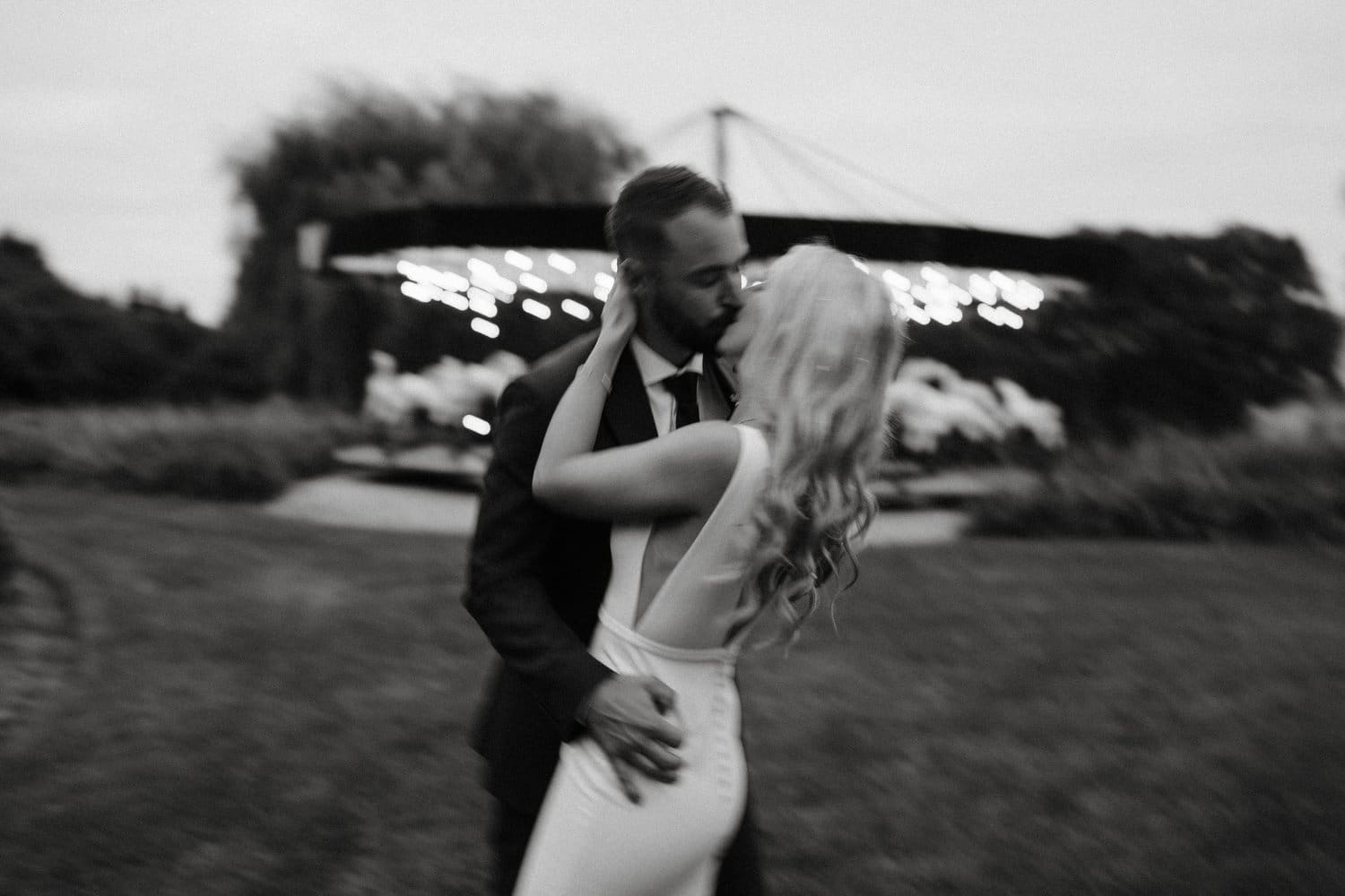 Bride and groom kissing at Bloom Field Gardens wedding in Newcastle, Ontario.