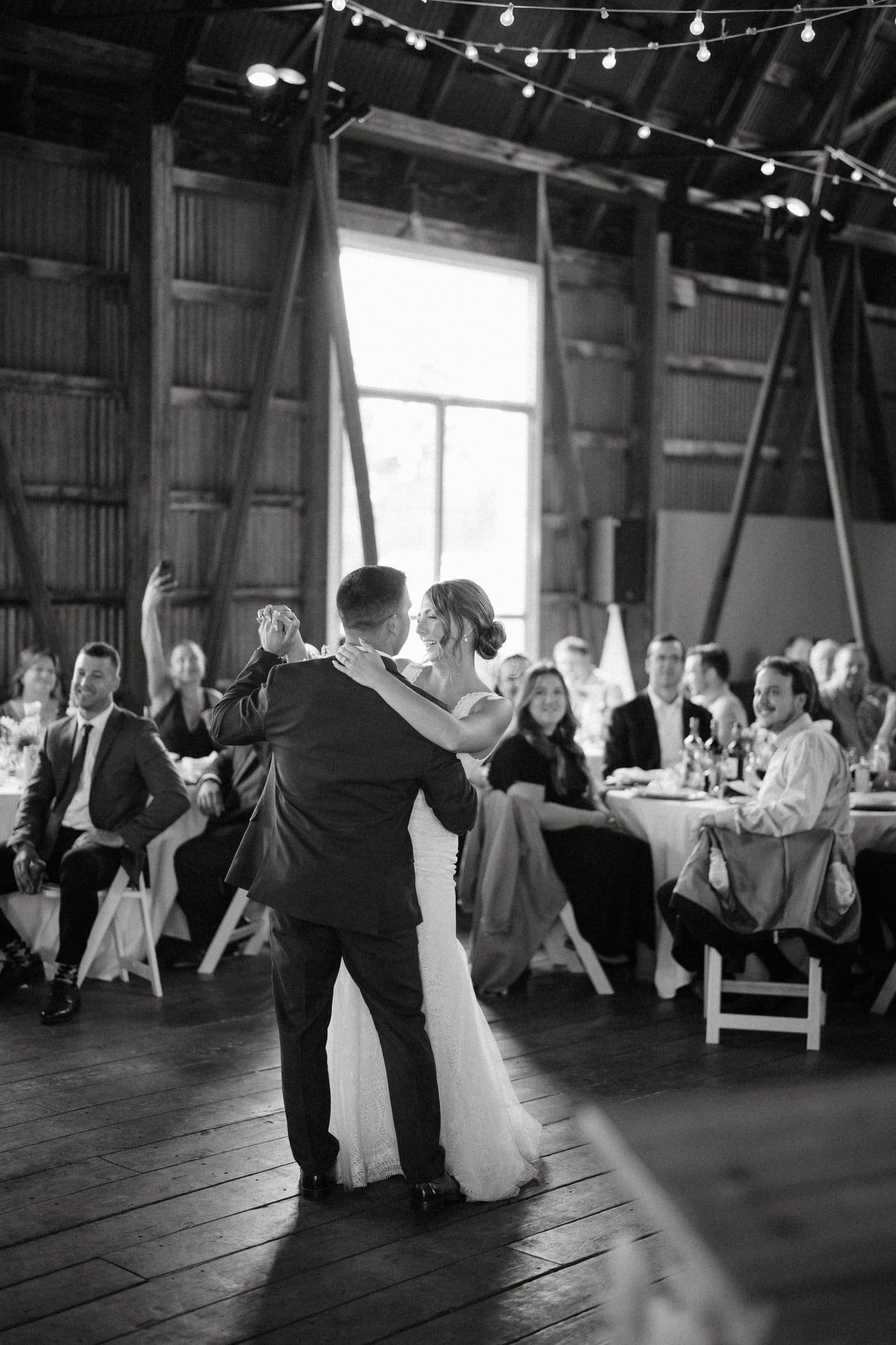 Couple sharing first dance at Lake to Skyview Farm wedding in Cobourg, Ontario.
