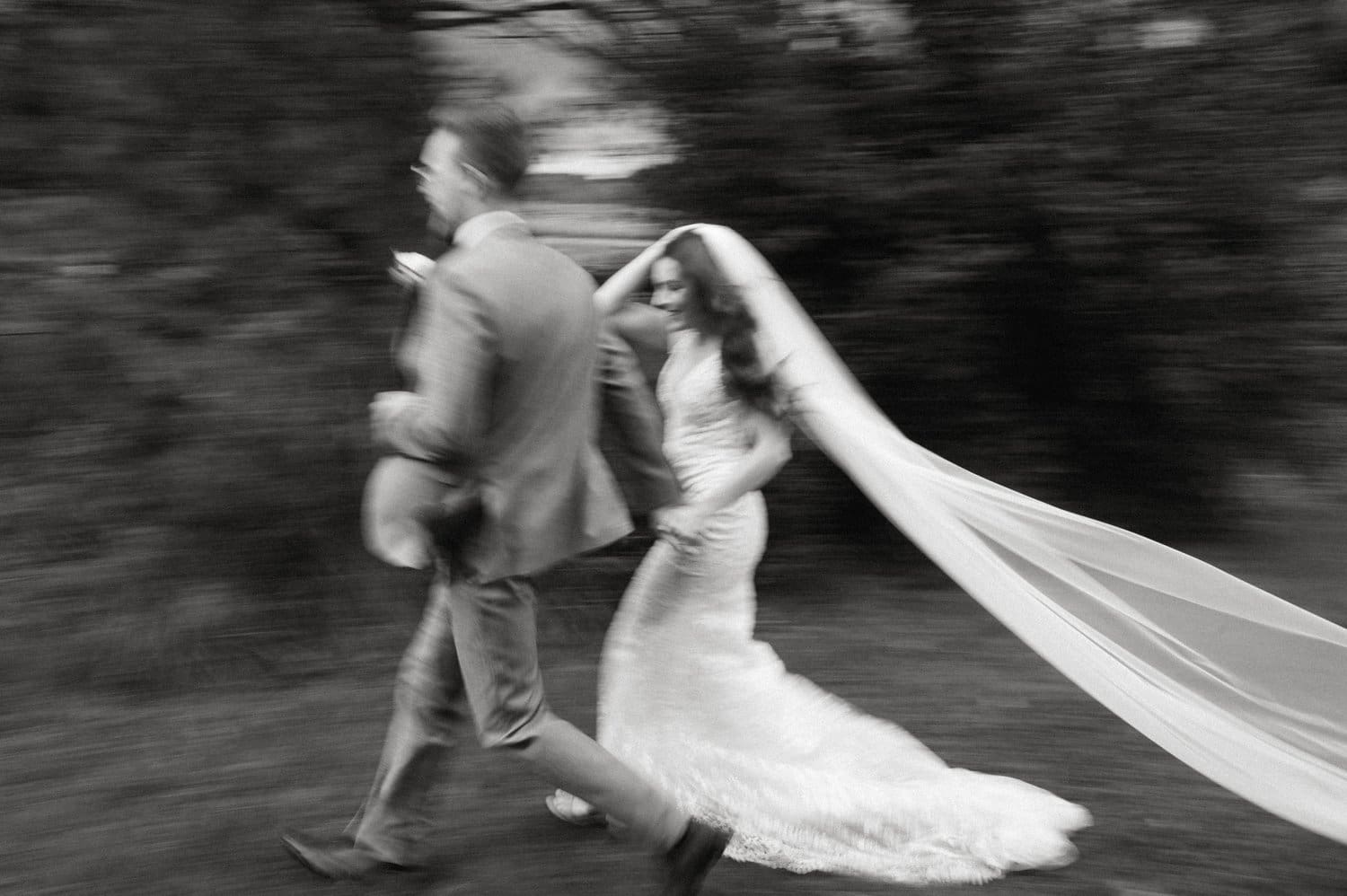Bride and groom running at intimate airbnb wedding.